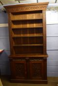Oak bookcase cabinet moulded and carved cornice over open shelving^ lower section with two drawers