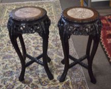 Pair of Anglo-Indian hardwood jardiniere stands^ each with central marble insets^ pierced and carved