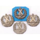 Quantity of four Cameron Highlander cap badges (4)