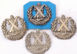 Quantity of four Cameron Highlander cap badges (4)