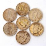 Assortment of seven American silver dollar coins dated 1923, 1922, 1921, 1922, 1922, 1922, 1922 (7)