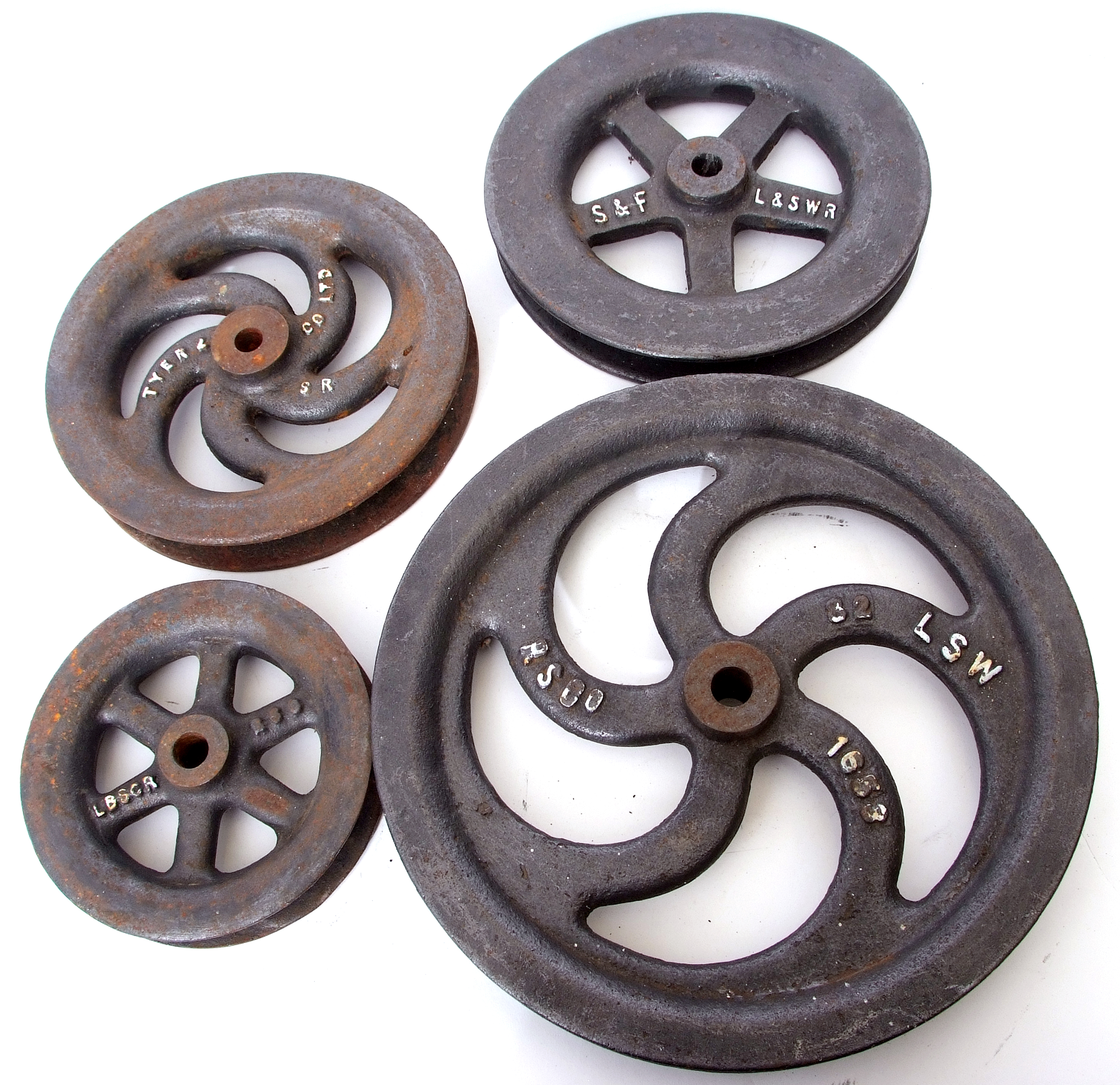 Set of four signalling pulleys for the London and South Western railway, two marked L & SWR, one