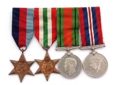 WWII group of four comprising 39-45 and Italy Stars, together with Defence Medal and War Medals,