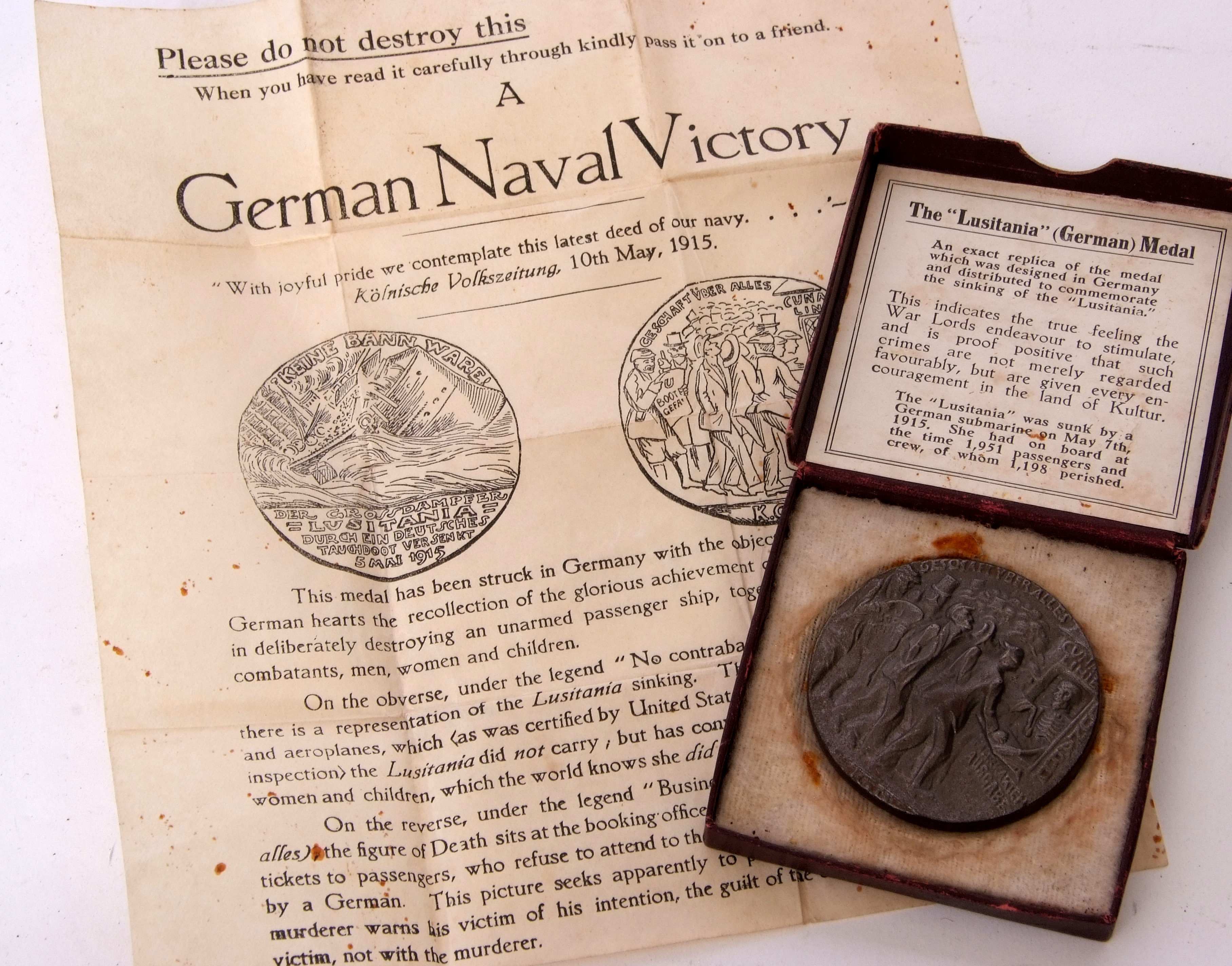 Exact replica of a German Lusitania medal with paperwork and associated cardboard box. Note: - Image 2 of 4