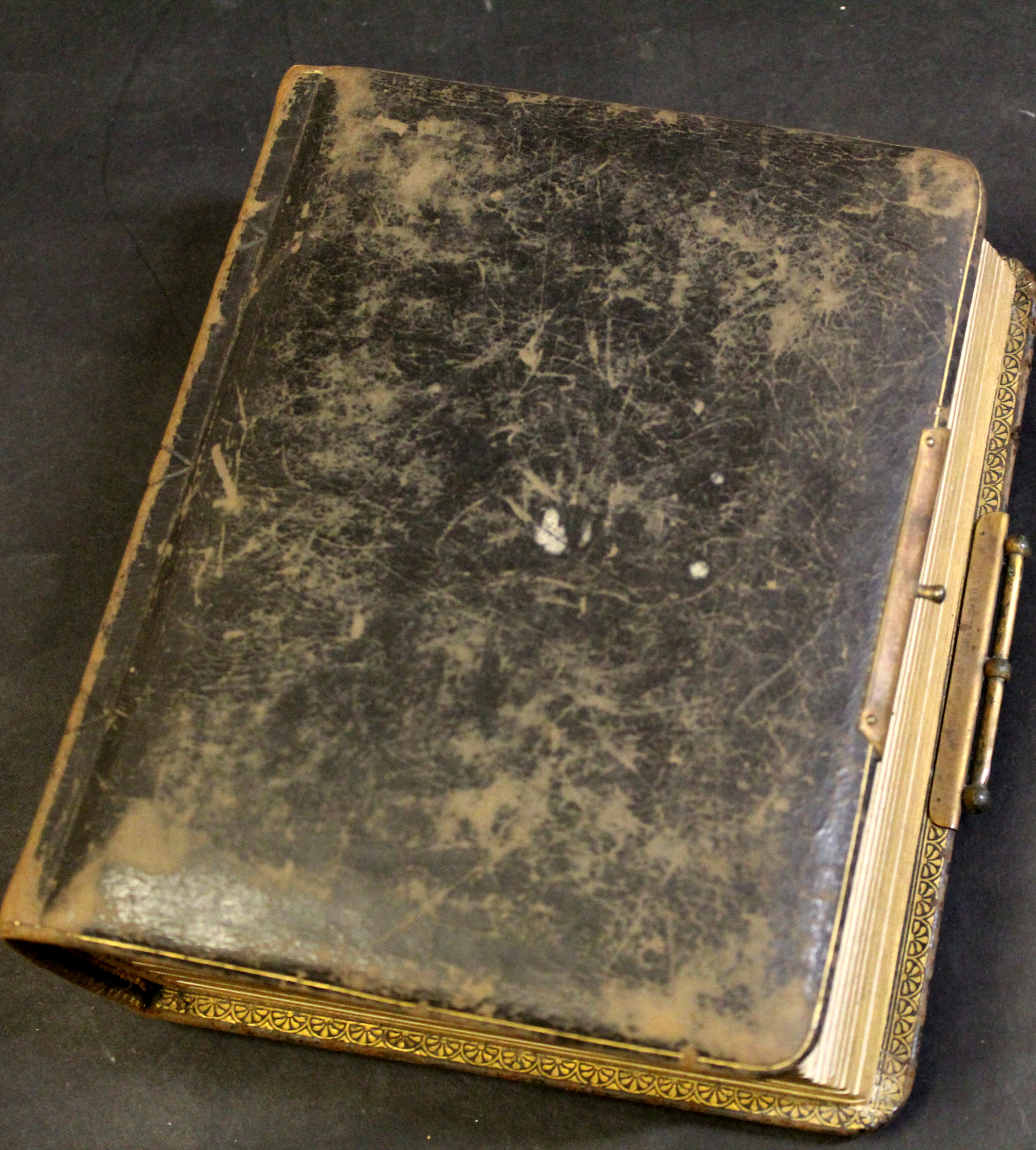 Late 19th century leather bound photograph album containing a quantity of photos of various family