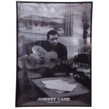 Framed poster of Johnny Cash. Note: sold on behalf of a local charity