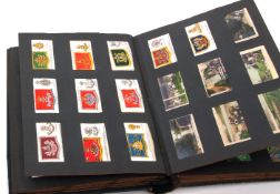 Album containing quantity of cigarette cards, mainly Natural History and some military insignia