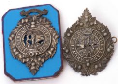 Pair of Argyll & Sutherland cap badges to include one with 1st Volunteer Btn to base