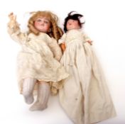Two vintage Armand Marseille porcelain dolls in laced clothing