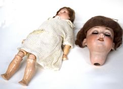 Vintage bisque head doll by Armand Marseille of Germany marked A3 0XM 390, together with a further