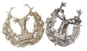 Pair of Gordon Highlander badges, one cast silver, unmarked, together with one white metal (2)