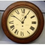 Railway clock, with circular wooden frame, enamel dial with Roman numerals, inscribed BR (E)