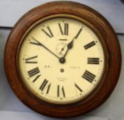 Railway clock, with circular wooden frame, enamel dial with Roman numerals, inscribed BR (E)