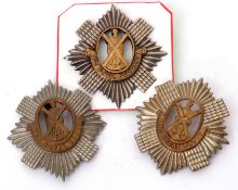 Group of three Scottish cap badges to include pair of bi-metal Royal Scots badges and bi-metal Royal