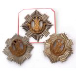 Group of three Scottish cap badges to include pair of bi-metal Royal Scots badges and bi-metal Royal