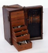 Wooden box containing a selection of watchmaker's tools in original case, with leather strap, the