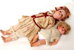 Jointed shoenut Hoffmiester bisque head doll together with a baby bisque head doll