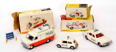 Group of three boxed Dinky police vehicles to include Ford Zodiac, Mini Cooper and Ford Transit