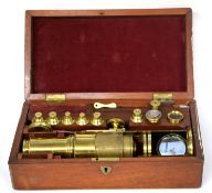 Boxed brass microscope with accessories