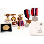 Pair of WWII British campaign medals to include 1939-45 Star, 1939-45 War medal, plus buttonhole