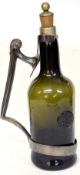 Late 18th century green coloured glass wine bottle with seal for Thompson and date 1796, with plated