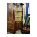 REPRODUCTION MAHOGANY BOW FRONTED GLAZE TOP FULL HEIGHT CORNER CUPBOARD ON SPLAYED SUPPORTS, 50CM