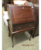 MID-20TH CENTURY MAHOGANY SMALL PROPORTION BUREAU WITH DROP FRONT WITH FULL WIDTH DRAWER RAISED ON