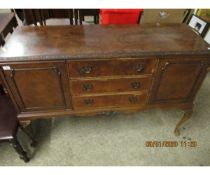 WALNUT SIDEBOARD WITH THREE DRAWERS FLANKED EITHER SIDE BY CUPBOARD DOORS RAISED ON PAD FEET