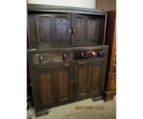 MID-20TH CENTURY LINENFOLD FRONT COURT CUPBOARD WITH TWO DOORS OVER TWO DRAWERS AND TWO LINENFOLD