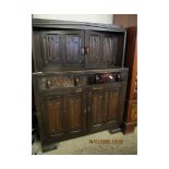 MID-20TH CENTURY LINENFOLD FRONT COURT CUPBOARD WITH TWO DOORS OVER TWO DRAWERS AND TWO LINENFOLD