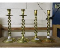 TWO PAIRS OF BRASS TWISTED COLUMN CANDLESTICKS