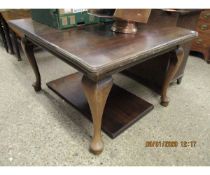 MAHOGANY FRAMED EXTENDING DINING TABLE WITH ONE EXTRA LEAF RAISED ON PAD FEET