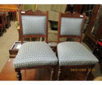 SET OF FOUR WALNUT FRAMED BLUE FLEUR DE LYS UPHOLSTERED DINING CHAIRS ON TURNED FRONT LEGS