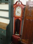 TEAK FRAMED GRANDMOTHER’S CLOCK