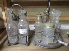TWO SILVER PLATED CRUET SETS, ONE WITH FOUR BOTTLES, THE OTHER WITH SIX BOTTLES