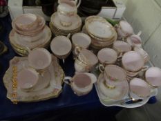 QUANTITY OF TUSCAN PUCE AND FLORAL DECORATED TEA WARES