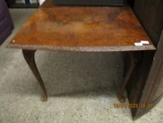 WALNUT EXTENDING DINING TABLE WITH CARVED EDGE RAISED ON PAD FEET