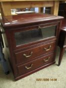 EASTERN ROSEWOOD SIDE CABINET WITH GLAZED DROP FRONT DOOR OVER TWO FULL WIDTH DRAWERS WITH BRASS