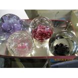 FOUR GLASS PAPERWEIGHTS