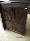 OLD CHARM OAK FRAMED LINEN FOLD FRONTED TV CABINET