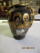 SMALL JAPANESE SATSUMA EARTHENWARE VASE DECORATED WITH JAPANESE CHARACTERS AND A SINUOUS DRAGON WITH