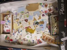 BOX CONTAINING MIXED USED POSTAGE STAMPS