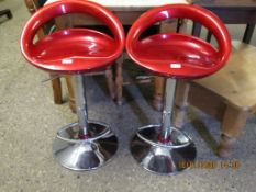 PAIR OF PRESSED PLASTIC AND CHROMIUM BASED ADJUSTABLE BAR STOOLS