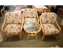 FOUR PIECE BAMBOO CONSERVATORY SUITE COMPRISING GLASS TOPPED CIRCULAR TABLE AND FOUR ARMCHAIRS