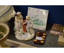 STAFFORDSHIRE FIGURE OF A WATER CARRIER, A FURTHER TREEN BRIDGE COUNTER AND A DELFT TILE