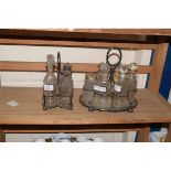 SILVER PLATED FOUR BOTTLE CRUET TOGETHER WITH A FURTHER SIX BOTTLED CRUET WITH ASSOCIATED BOTTLES (