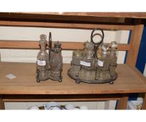 SILVER PLATED FOUR BOTTLE CRUET TOGETHER WITH A FURTHER SIX BOTTLED CRUET WITH ASSOCIATED BOTTLES (
