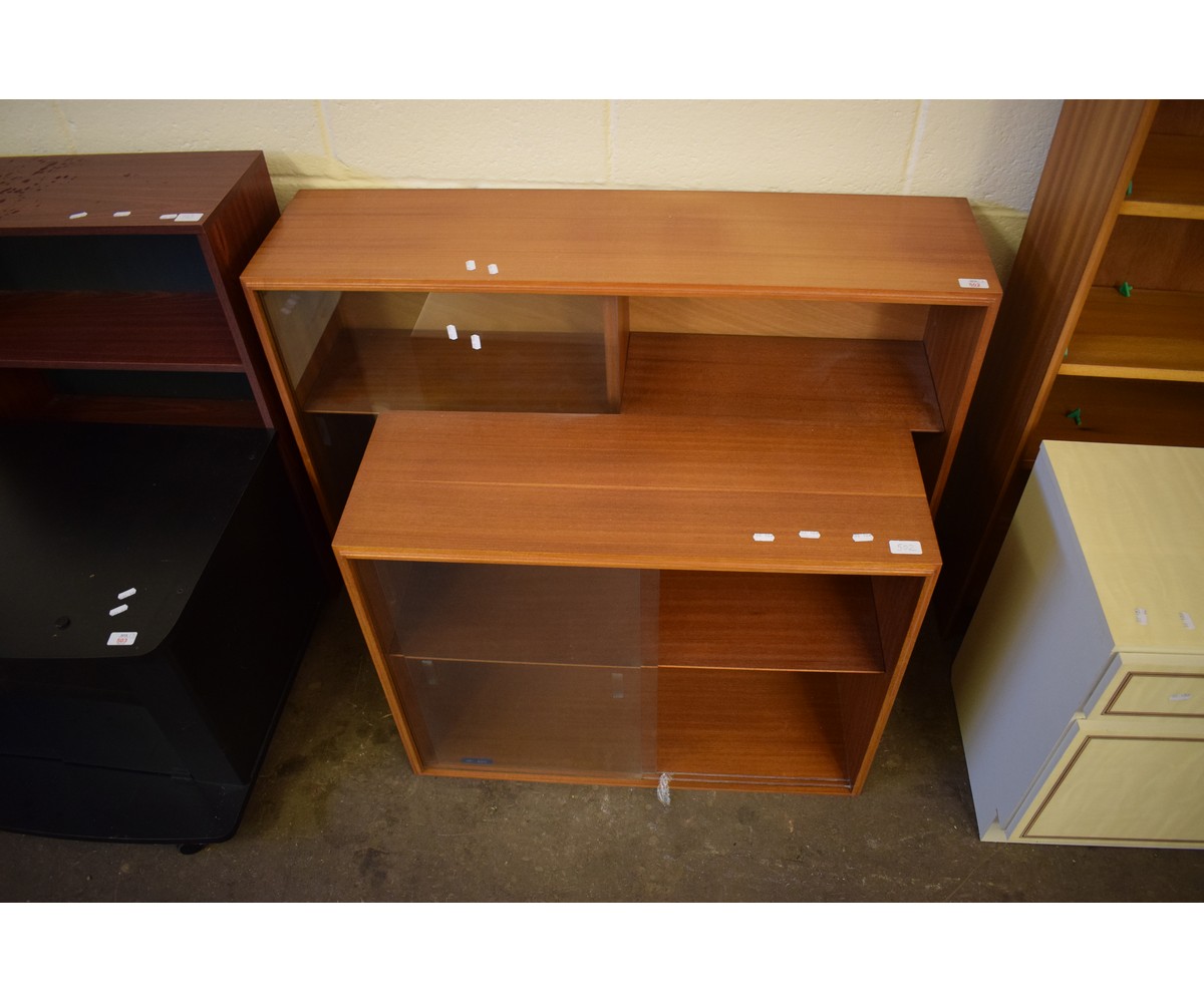 TWO TEAK FRAMED BOOKCASES WITH GLASS SLIDING DOORS