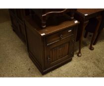 OLD CHARM OAK BEDSIDE CUPBOARD WITH SINGLE DRAWER OVER LINENFOLD CUPBOARD DOOR