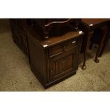 OLD CHARM OAK BEDSIDE CUPBOARD WITH SINGLE DRAWER OVER LINENFOLD CUPBOARD DOOR